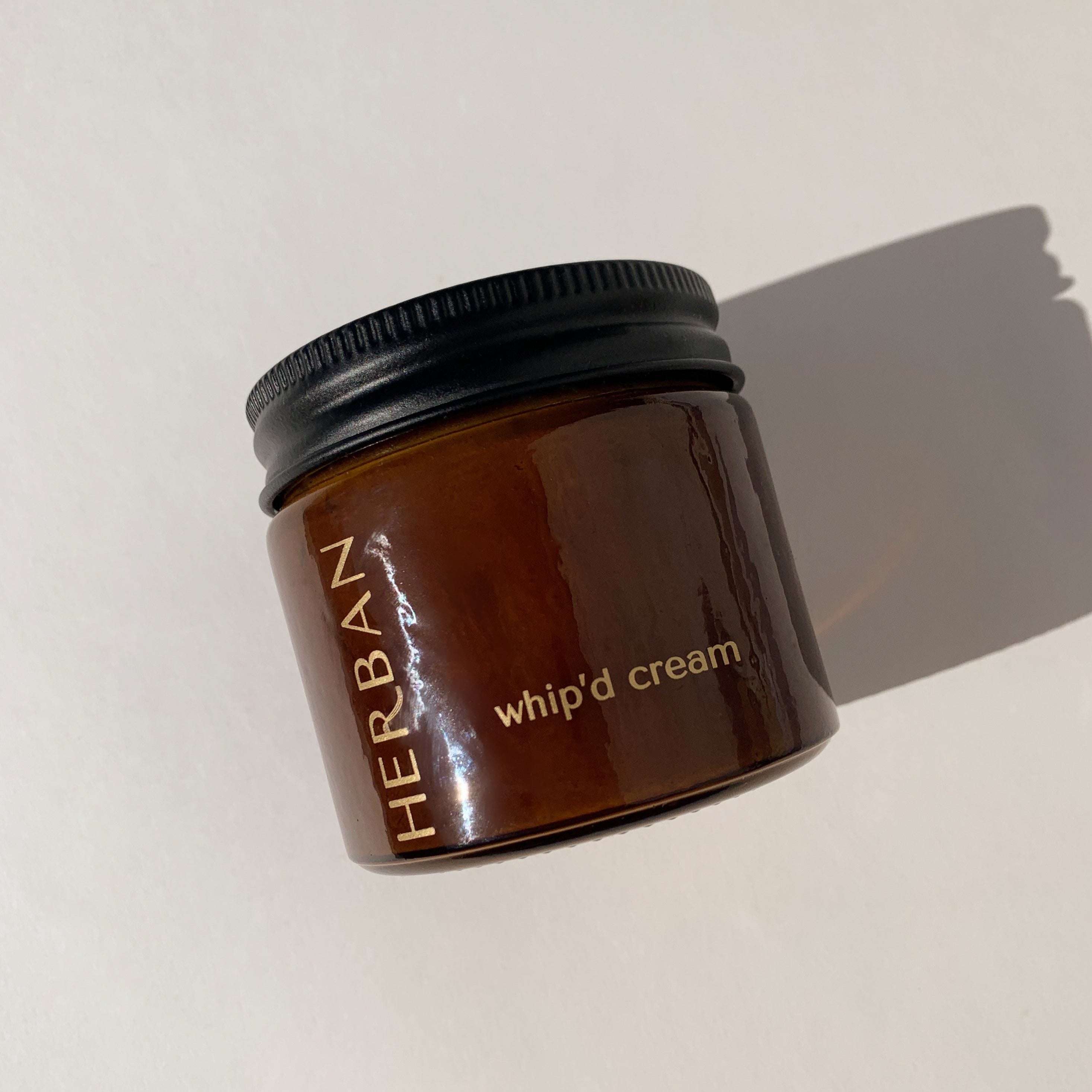 Herban’s Whip’d Cream total body lotion in a glass jar. Shea butter, fatty acids and vitamins A, E and F